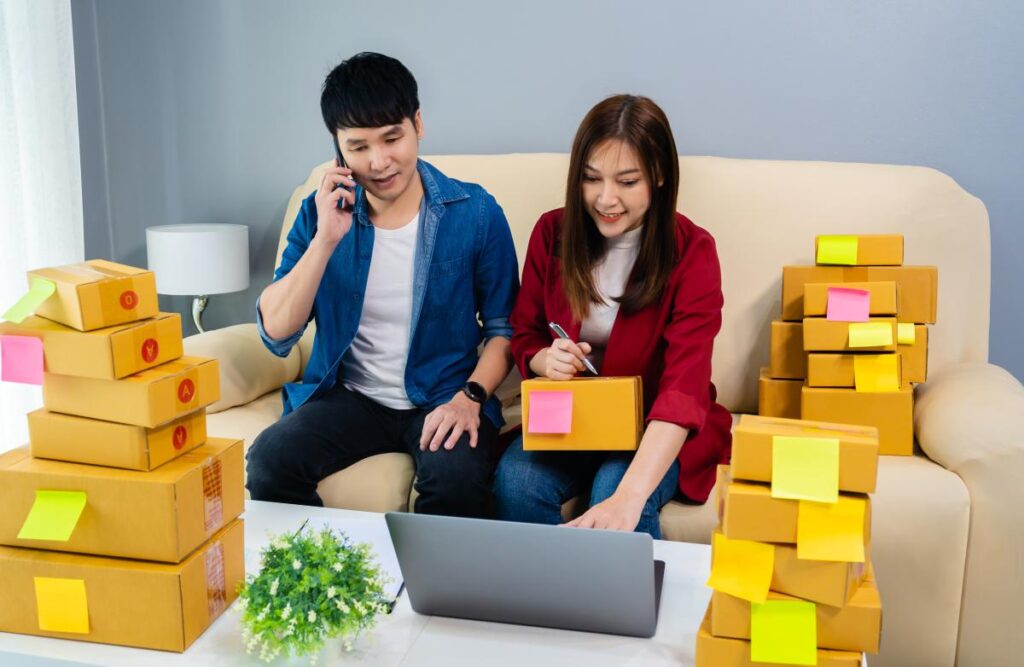 young entrepreneurs using phone to convince customers

