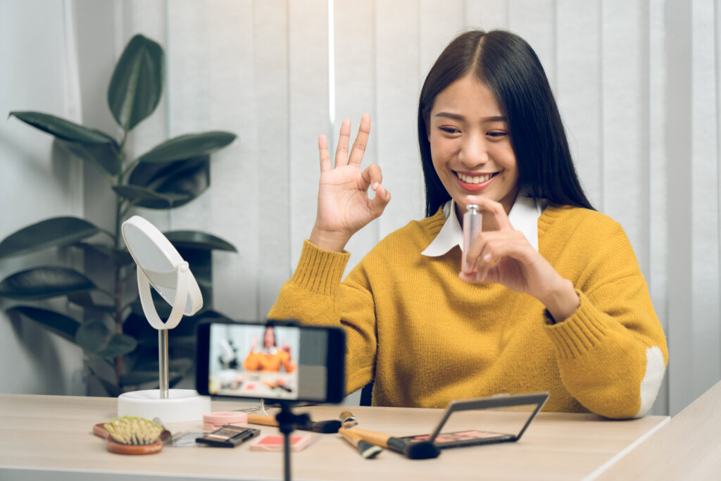 Young woman utilizing social media for commerce  
