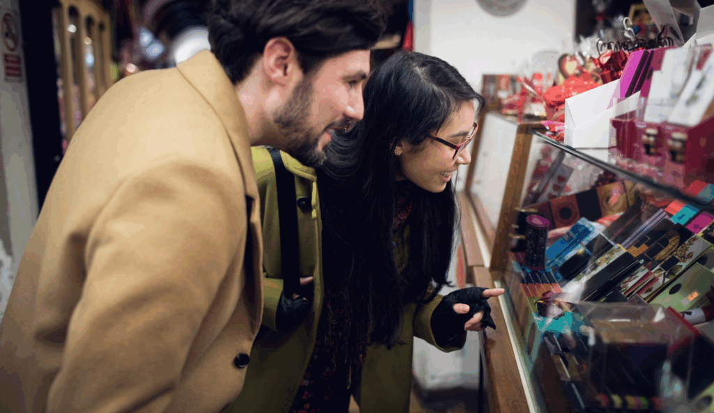 Chinese gen Z couple standing outside a gift shop