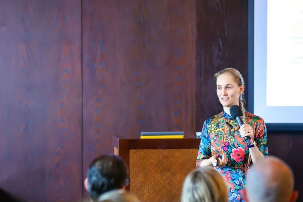 Ashley Dudarenok presenting insights on AI, retail, and consumer behavior in China at a conference.