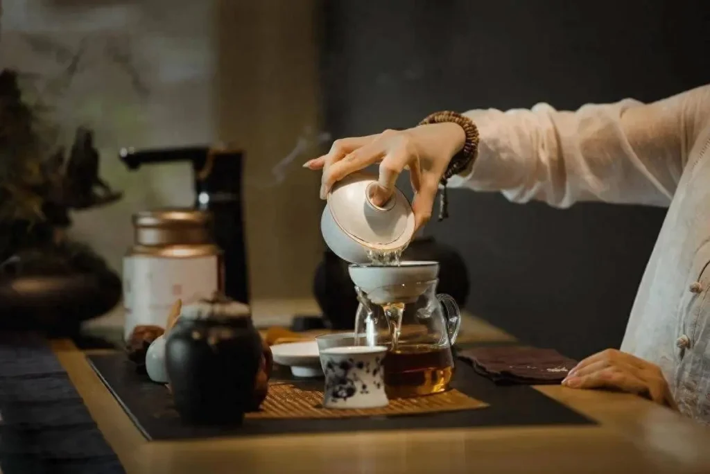 Traditional tea pouring scene representing daily rituals and small lifestyle indulgences in China