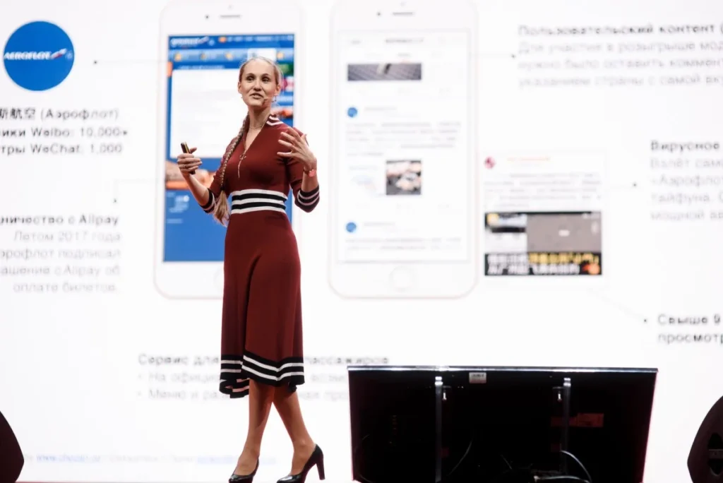 Keynote speaker presenting China consumer insights on platforms, scrutiny, and brand trust.