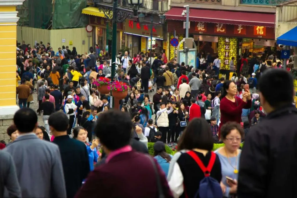 Crowded Chinese retail street reflecting selective spending and cautious consumer choice in the Deep Trust Era.