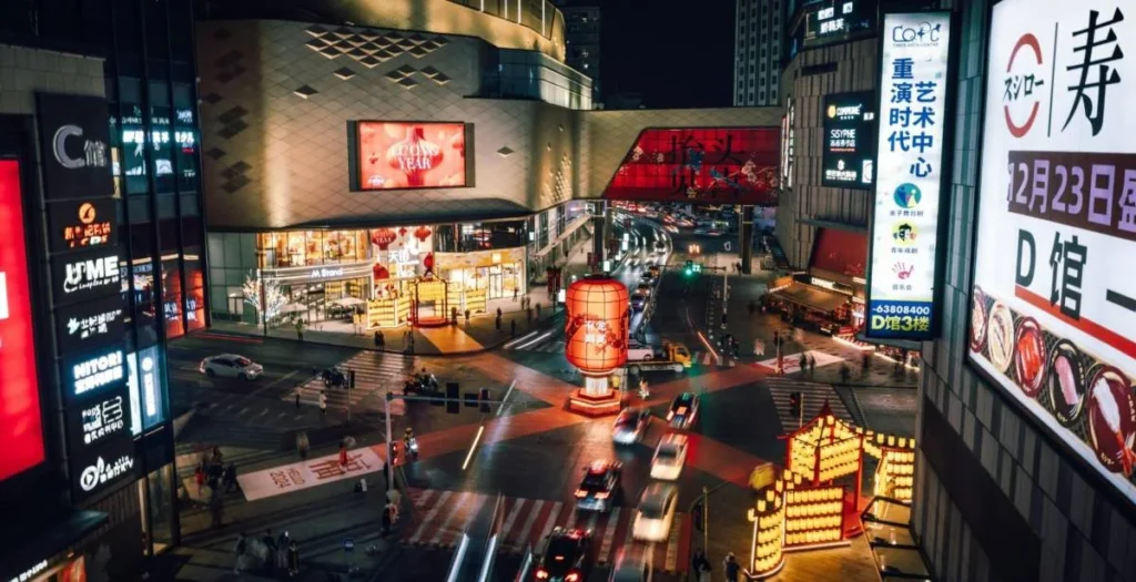 Busy China retail street showing how brands in China compete for attention across physical and digital consumer journeys