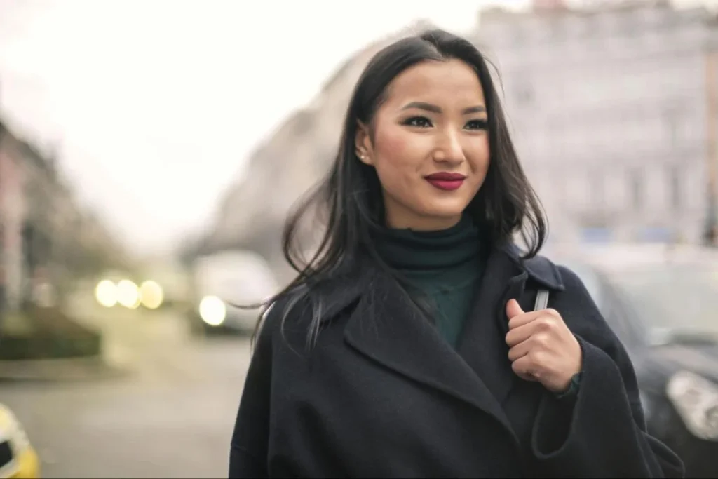 Woman in an urban setting, representing the emotional value and reassurance brands can offer solo consumers.