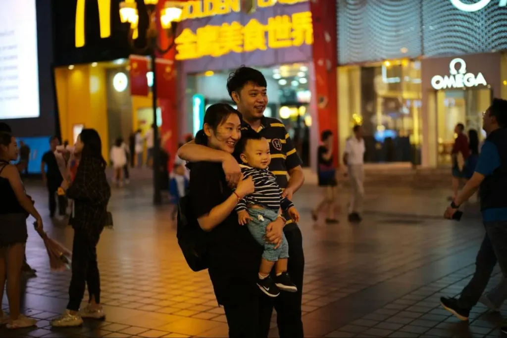 Family in a Chinese shopping district, highlighting how fair service and reliable experiences support brand loyalty.