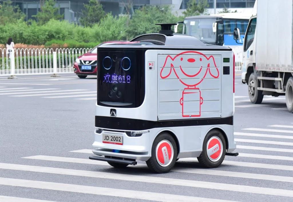 JD.com autonomous delivery robot operating on city street showcasing last-mile logistics innovation in China