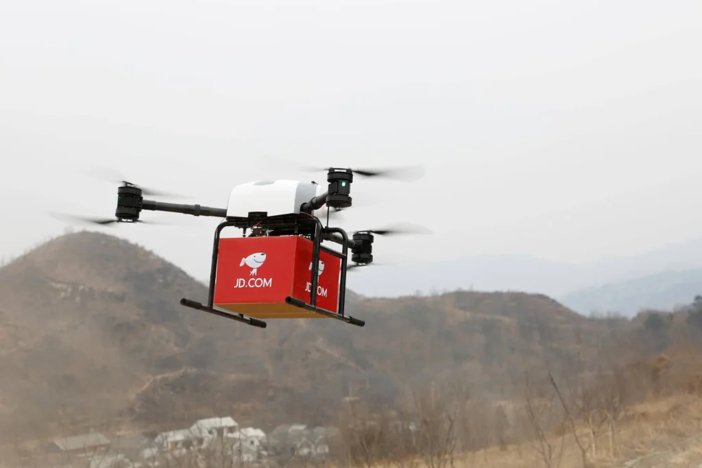 JD.com drone delivering package in rural China demonstrating autonomous logistics and supply chain innovation