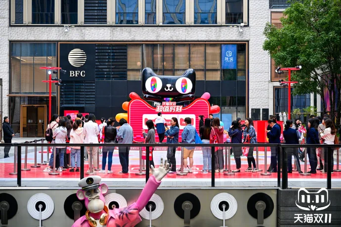 Crowd gathered at Tmall Double 11 shopping festival event with branded installation