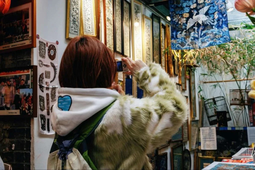 Shopper exploring a Chinese retail street, showing how brands can study solo life as a modern consumer system.