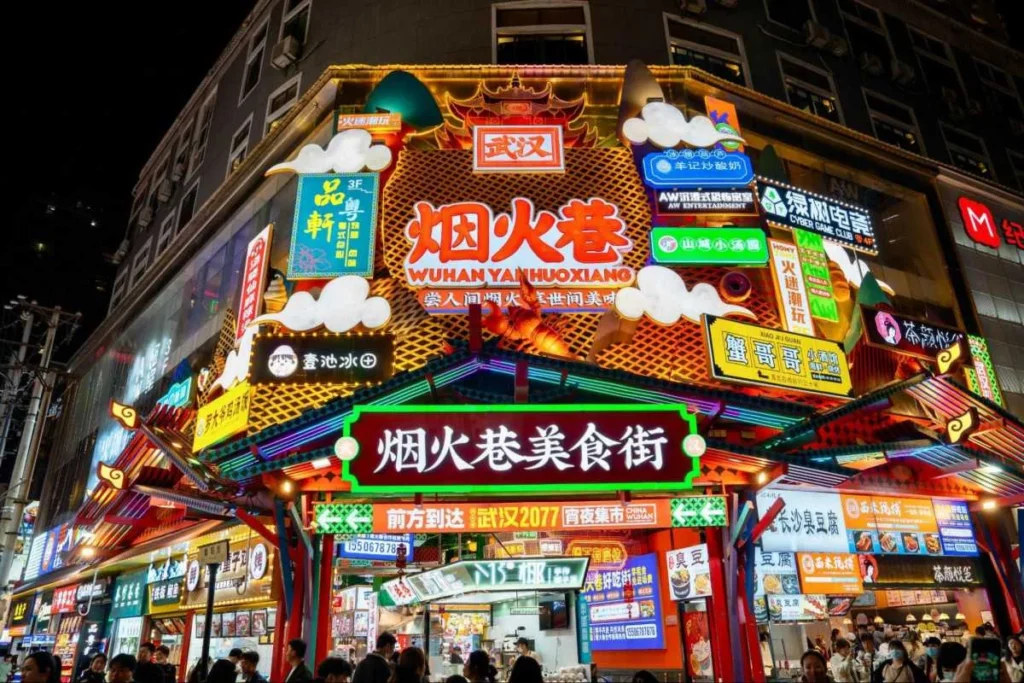 Busy Wuhan food street at night, reflecting how viral demand and public scrutiny can reshape brand trust.