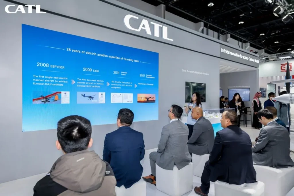 CATL booth presentation showing electric aviation milestones to an audience.