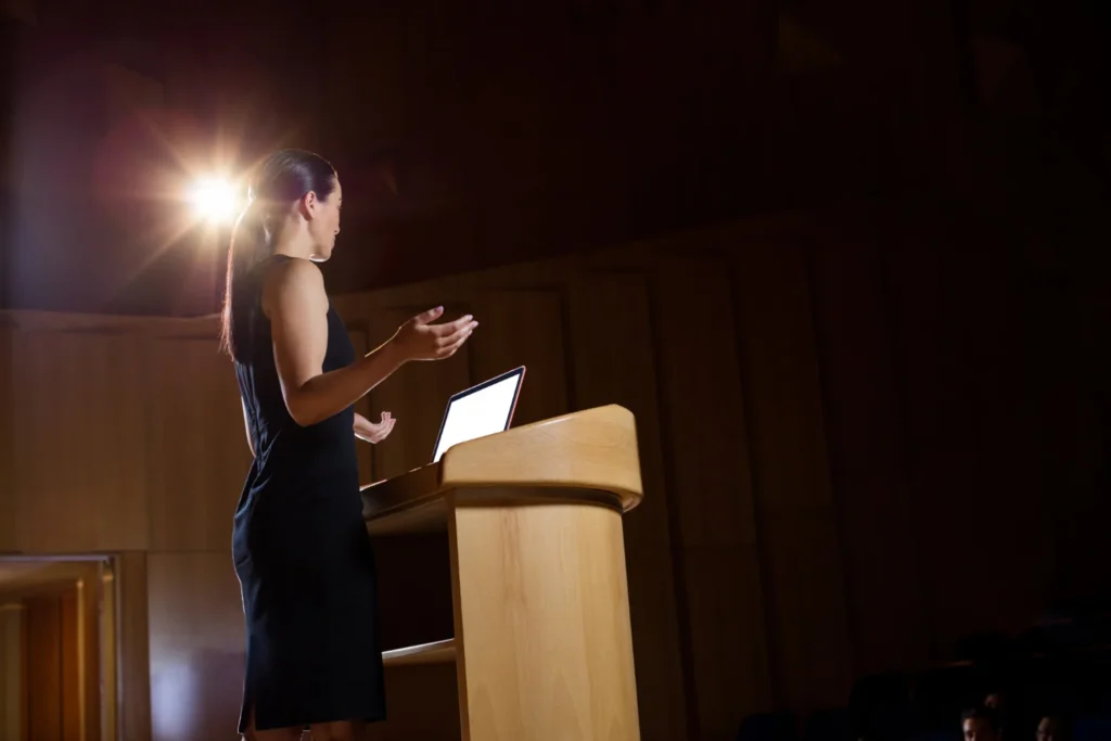 Speaker presenting at podium