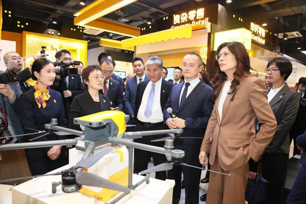 Meituan drone delivery technology displayed to visitors at a retail exhibition.