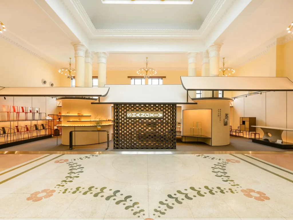 Spacious Shang Xia retail interior with furniture and craft displays.