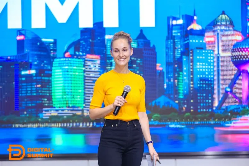 Speaker holding a microphone at a digital summit