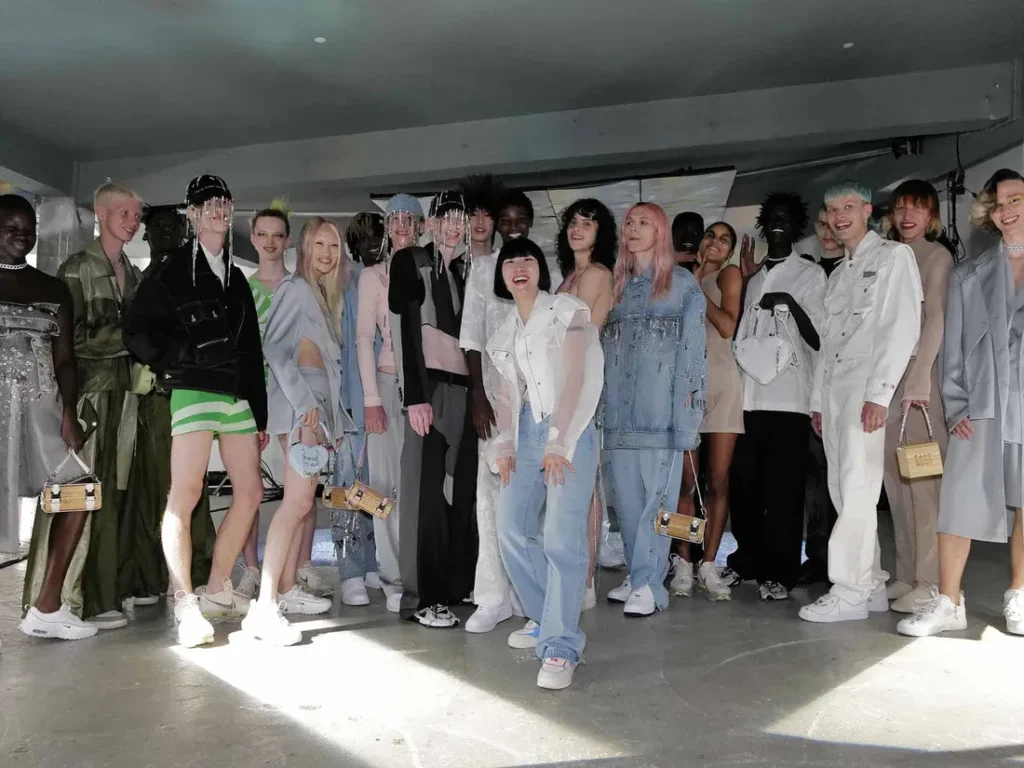 Designer and models backstage after a Feng Chen Wang show