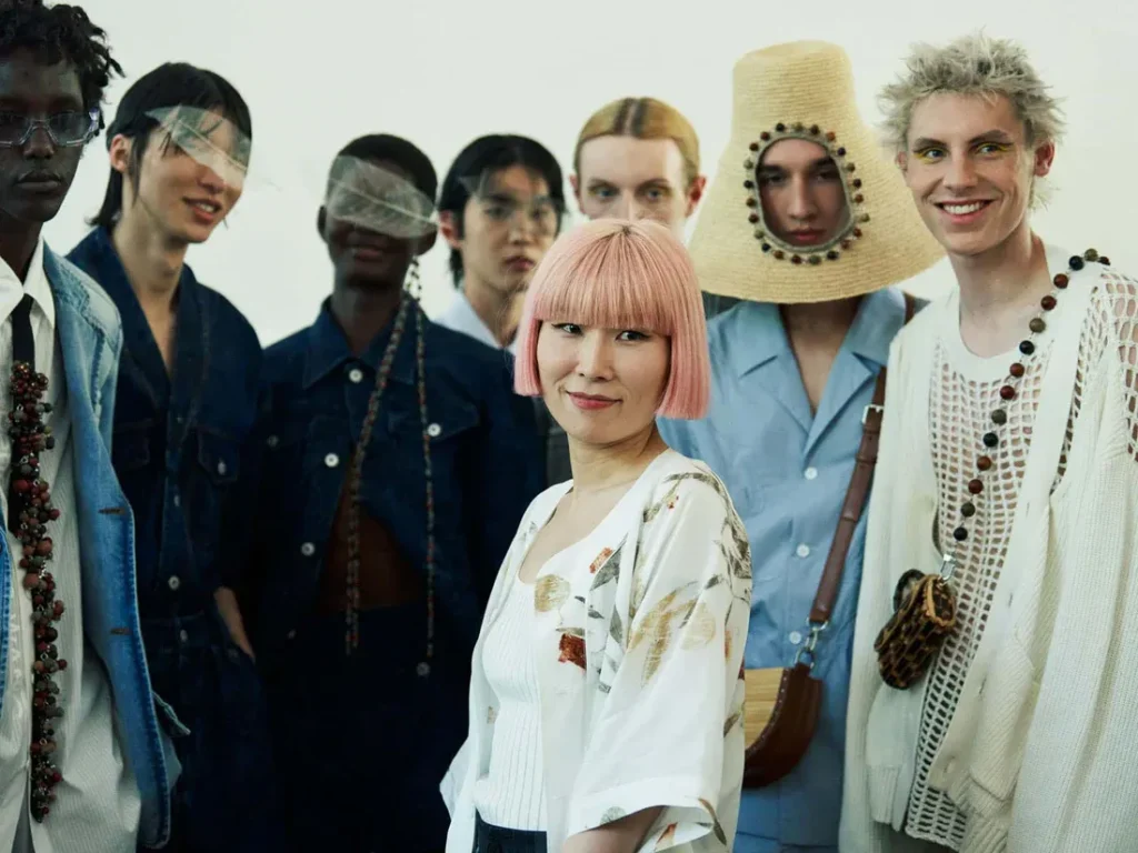 Feng Chen Wang with models in creative runway looks