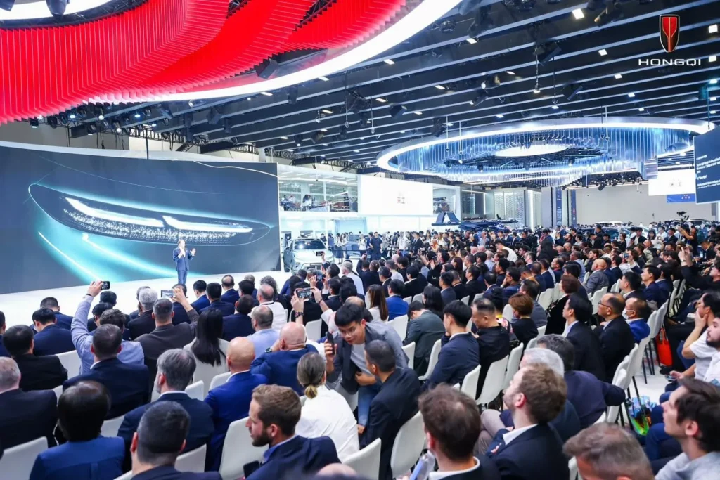 Hongqi auto show presentation with a large audience