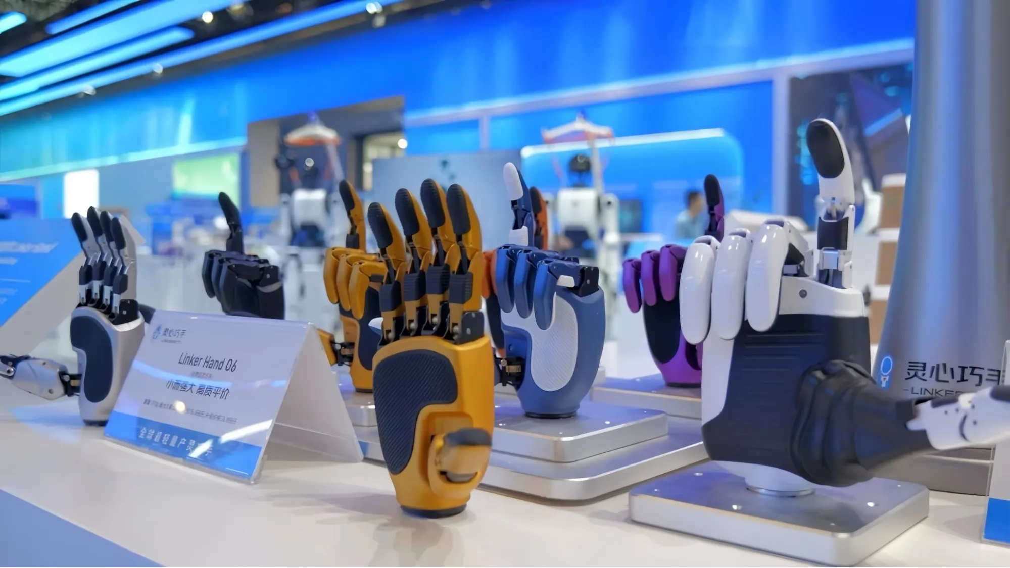 Colorful robotic prosthetic hands displayed at a technology exhibition