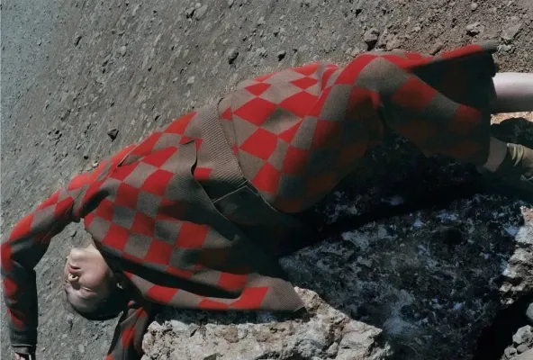 Model wearing red and brown patterned Uma Wang knitwear