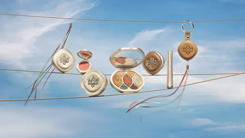 Florasis compacts and lip products hanging against sky