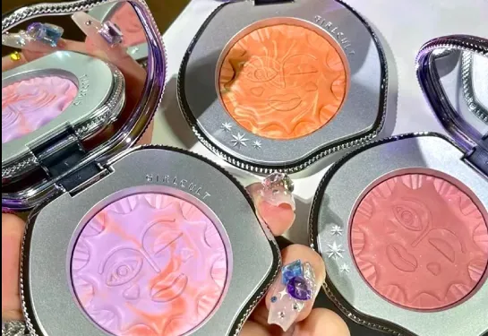Embossed Girlcult blush compacts in pink and orange shades