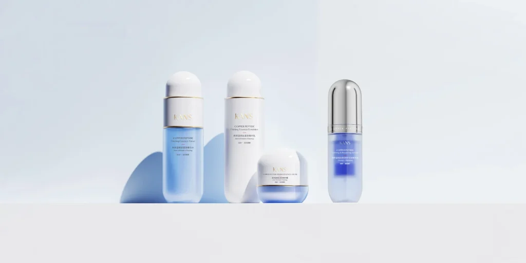 KANS copper peptide skincare bottles and cream displayed on a soft blue background