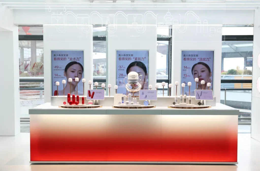 KANS skincare products displayed at a bright retail counter with product posters