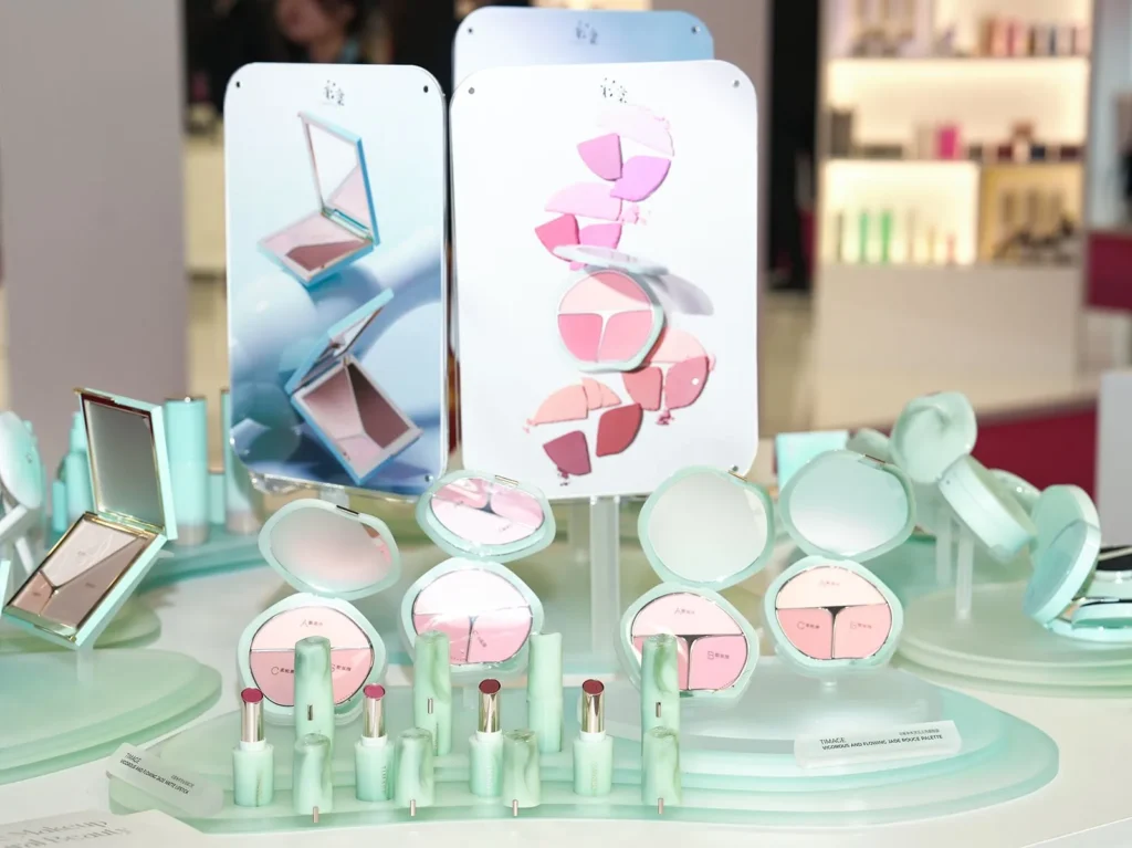 Pastel makeup products displayed on a retail counter
