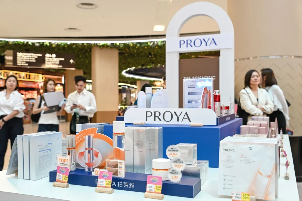 PROYA skincare products arranged on a mall retail counter