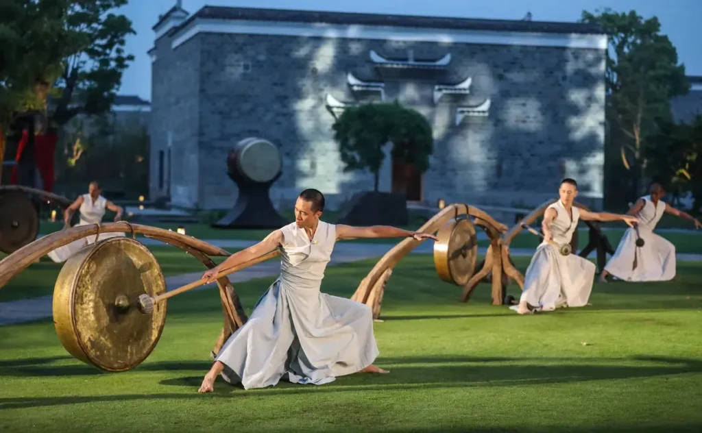 Traditional cultural performance with large gongs at Amanyangyun