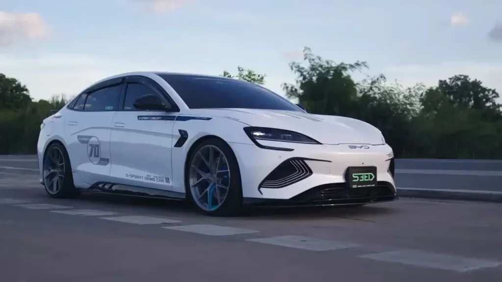 White BYD electric sports sedan on the road