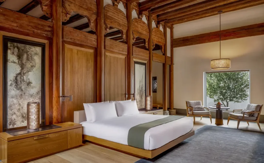 Luxury hotel bedroom with historic wooden architecture