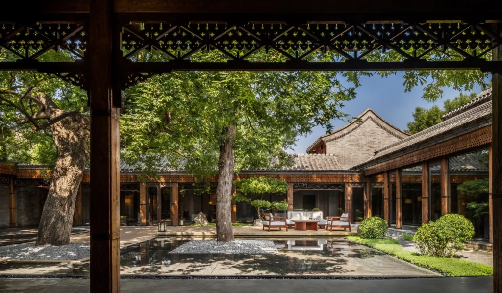 Traditional courtyard hotel with mature trees in Beijing