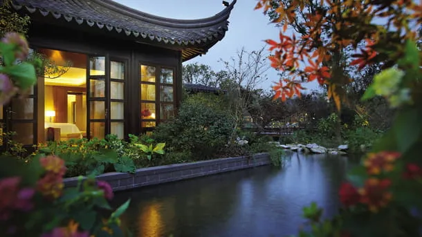 Traditional Chinese garden hotel beside a peaceful waterway