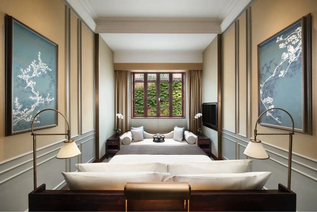 Elegant luxury hotel bedroom with Chinese artwork
