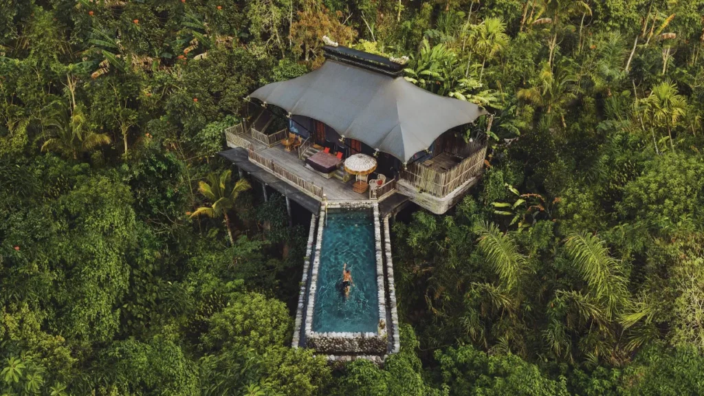 Luxury private pool villa surrounded by tropical greenery
