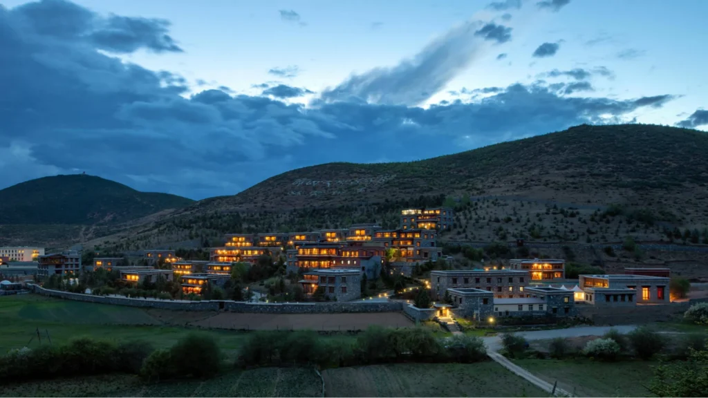 Mountain resort illuminated at dusk in Shangri-La