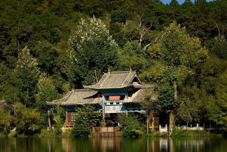Traditional Chinese pavilion beside a scenic lake